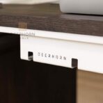 biały organizer pod biurko na kable